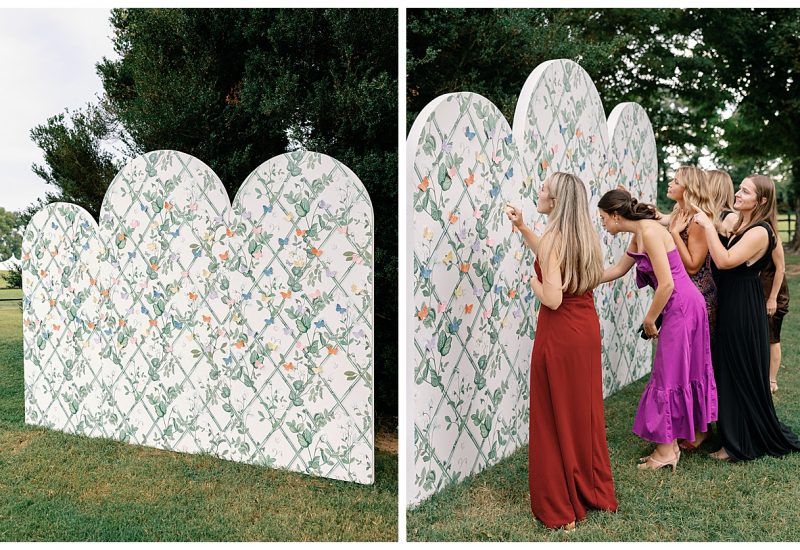 A dreamy, garden-inspired escort display featuring the Provence Arched Backdrop adorned with delicate floral and butterfly accents. Something Vintage Rentals, the U.S. East Coast’s best event rental and wedding decor company.