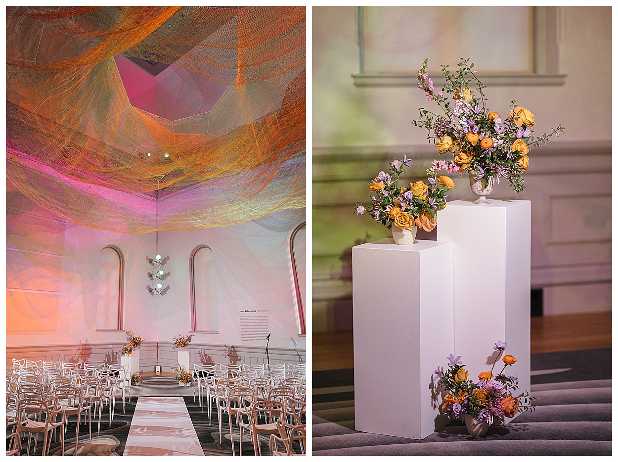 A stunning wedding ceremony setup at the Renwick Gallery featuring Mia White Dining Chairs and Wickham and Bingley Modern Pillars with elegant floral arrangements. Rentals by Something Vintage Rentals, the U.S. East Coast’s best event rental and wedding decor company.