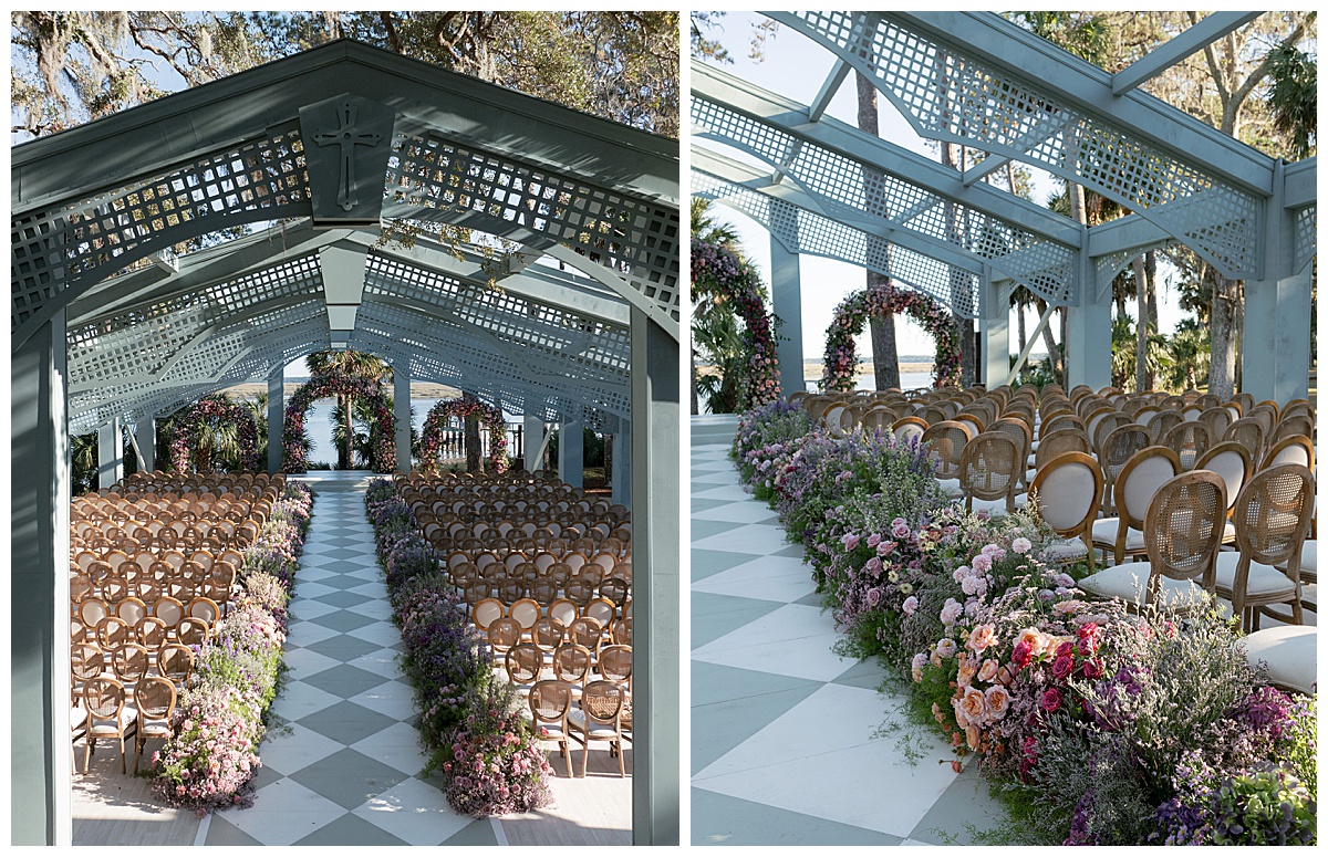 Aisle lined with florals and wood chairs under a trellis-covered structure, leading to a floral arch by the water.
Rentals by Something Vintage Rentals, the U.S. East Coast’s best event rental and wedding decor company.