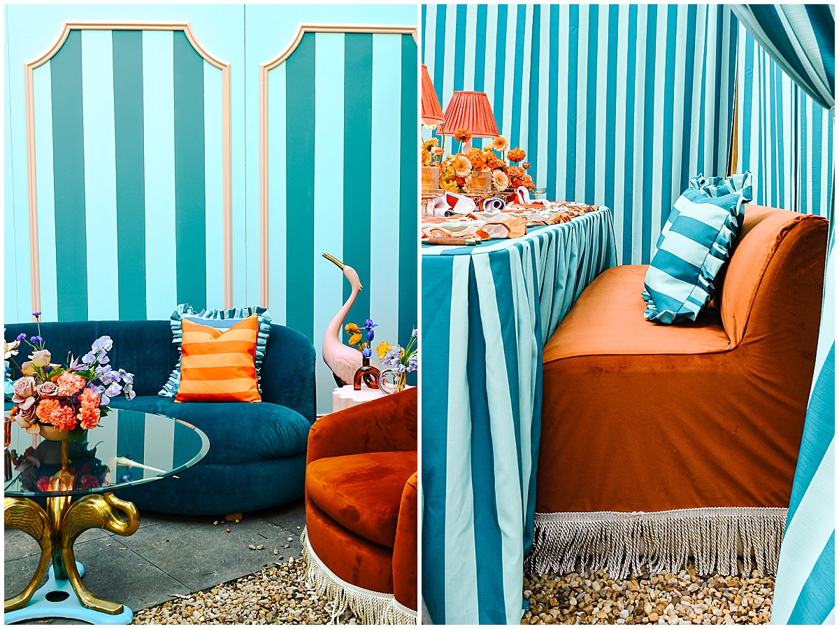 Teal and white striped walls and linens with burnt orange velvet sofas, striped throw pillows, and fringe details for 2026 wedding trends by Something Vintage Rentals